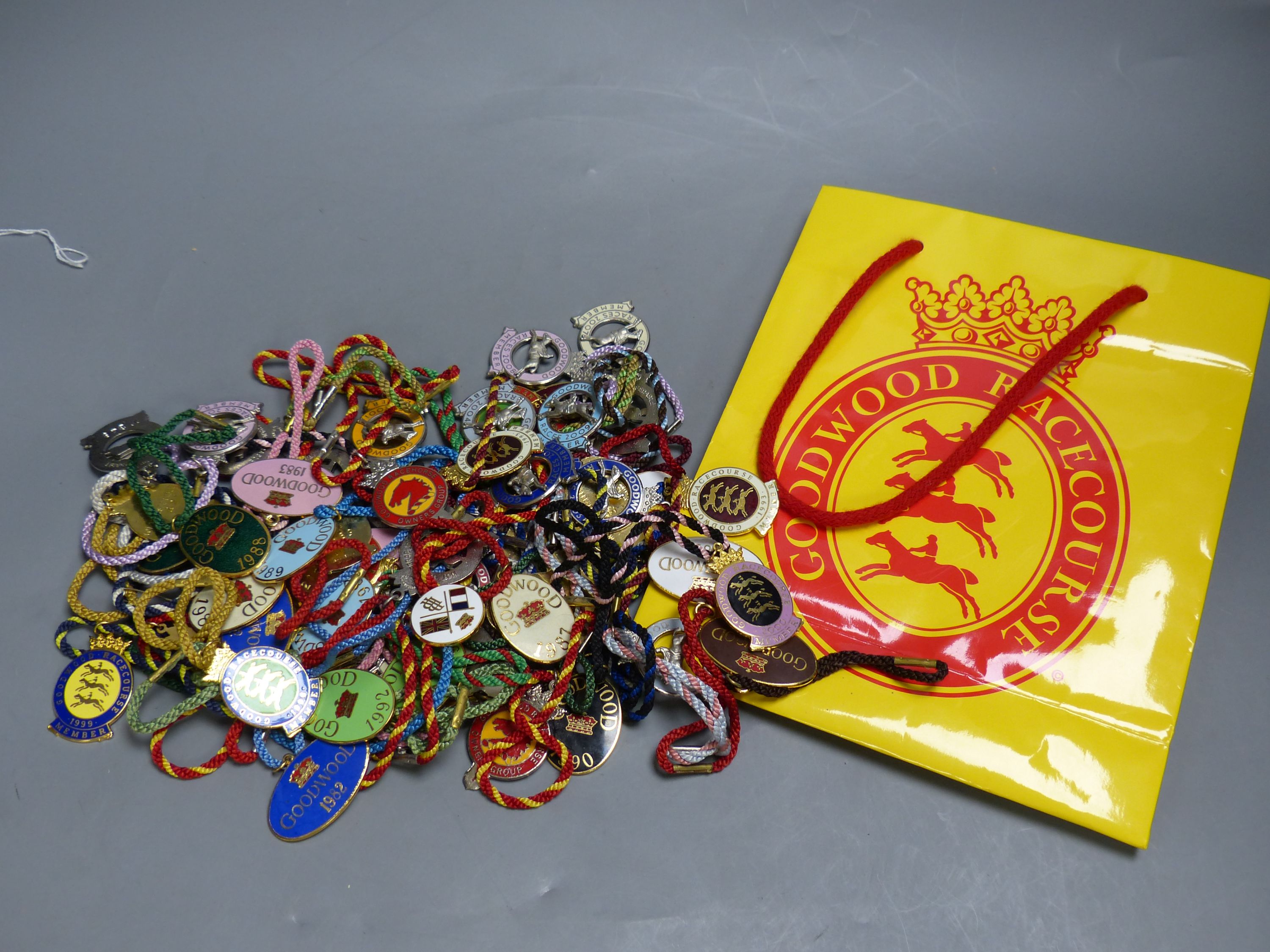 A collection of 60 Goodwood Racecourse Members enamelled badges, 1980's-2000's